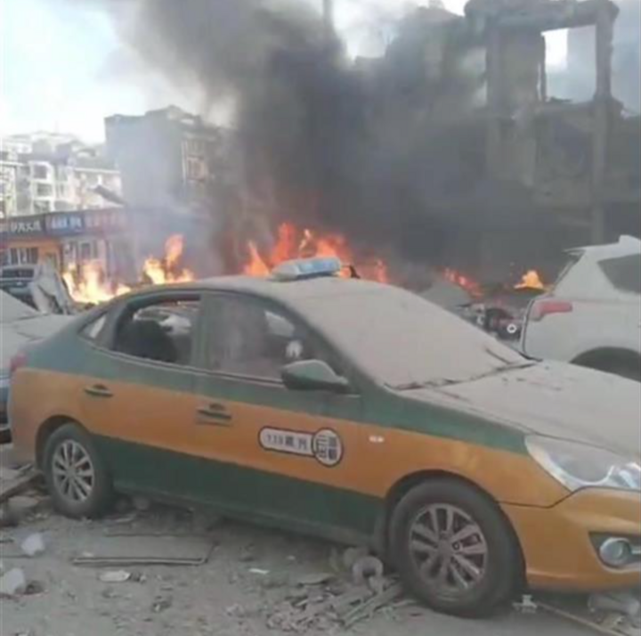 Destroyed vehicles at the scene of the explosion