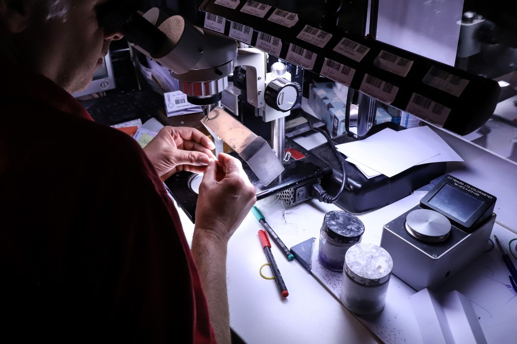 A worker inspecting a diamond in Antwerp, Belgium