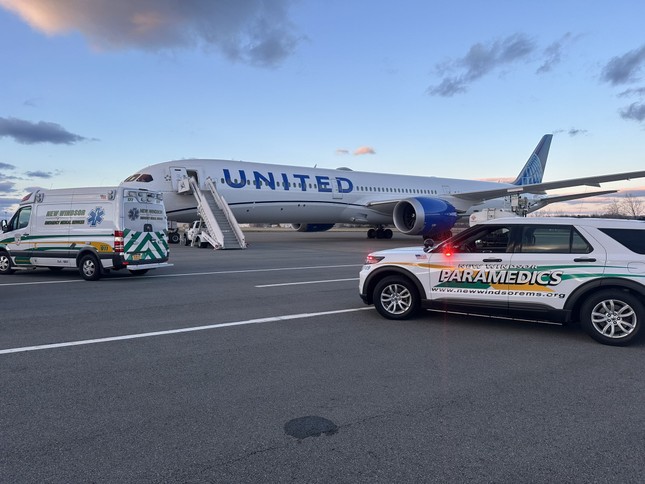 Rescue team approaching a United Airlines aircraft